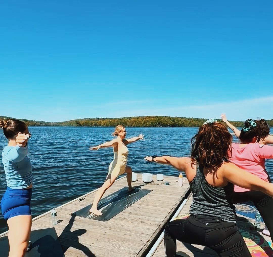 Yoga on the pier during a bridal weekend